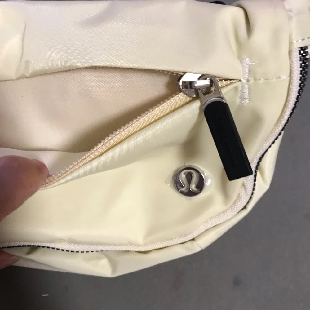 lululemon athletica cream fold-over wristlet with front zip 2L